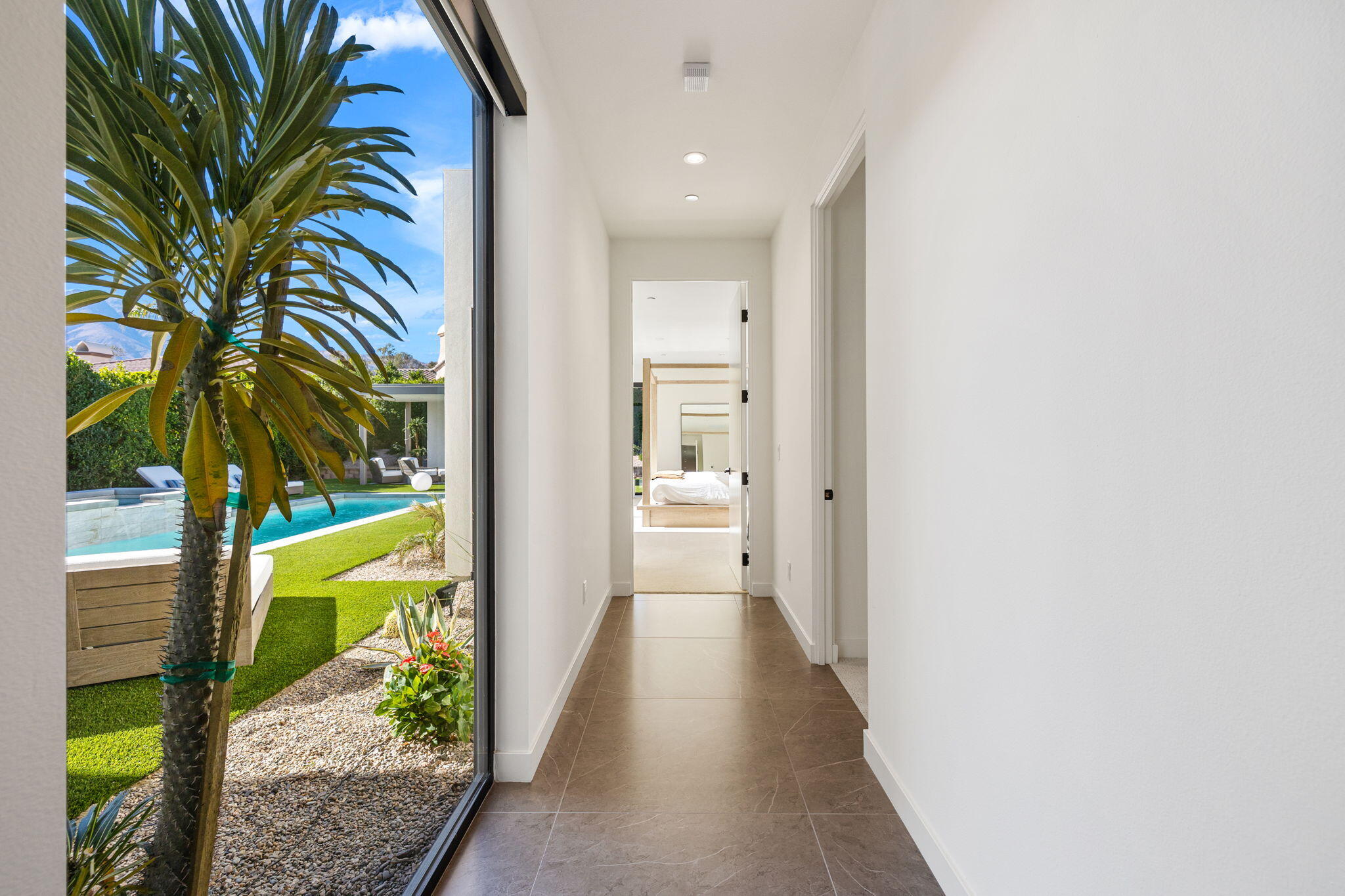 57809 Santo Thomas La Quinta, CA 92253 - Photo 26 of 51 a view of a hallway with wooden floor and a potted plant