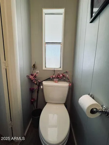a bathroom with a toilet and a sink