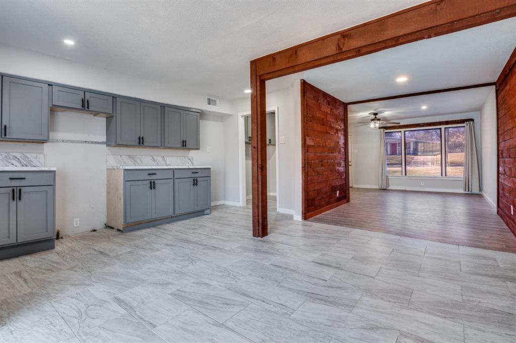 4412 Utah Avenue Dallas, TX 75216 - Photo 5 of 11 a view of a kitchen with a sink and a refrigerator