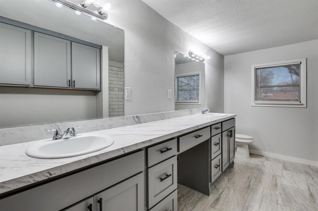 4412 Utah Avenue Dallas, TX 75216 - Photo 7 of 11 a bathroom with a sink double vanity granite and a