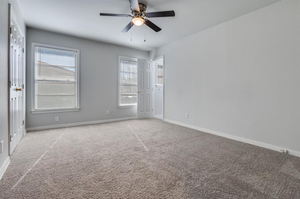 4412 Utah Avenue Dallas, TX 75216 - Photo 9 of 11 an empty room with windows and fan
