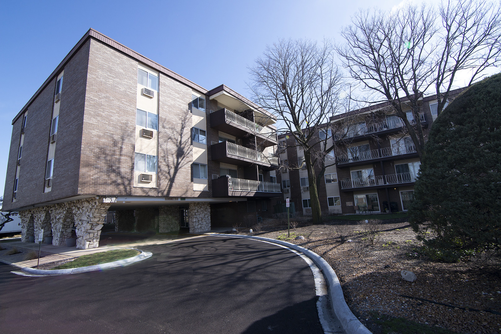 1301 South Finley Road, Unit 204 Lombard, IL 60148 - Photo 1 of 24 a front view of a building with a yard