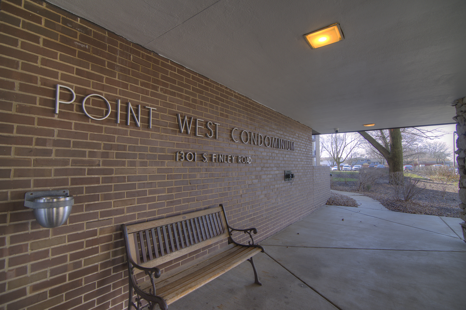 1301 South Finley Road, Unit 204 Lombard, IL 60148 - Photo 2 of 24 a view of a brick wall with staircase