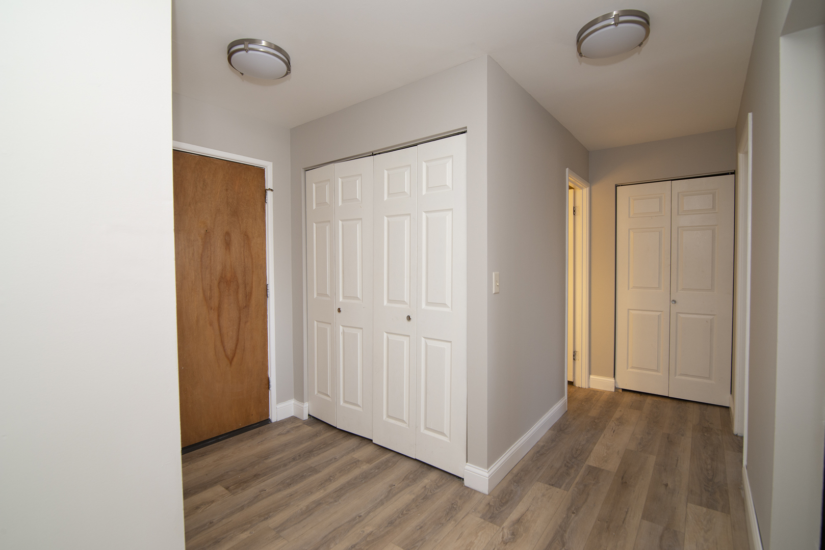 1301 South Finley Road, Unit 204 Lombard, IL 60148 - Photo 6 of 24 a view of a livingroom with wooden floor