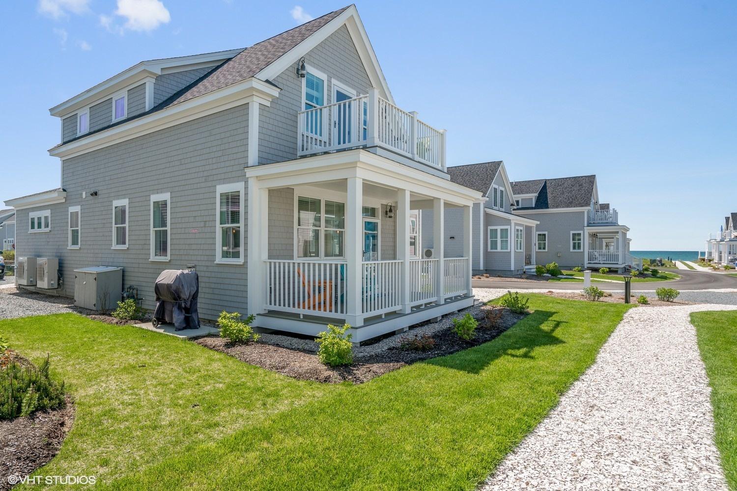 a view of a house with backyard porch and sitting area