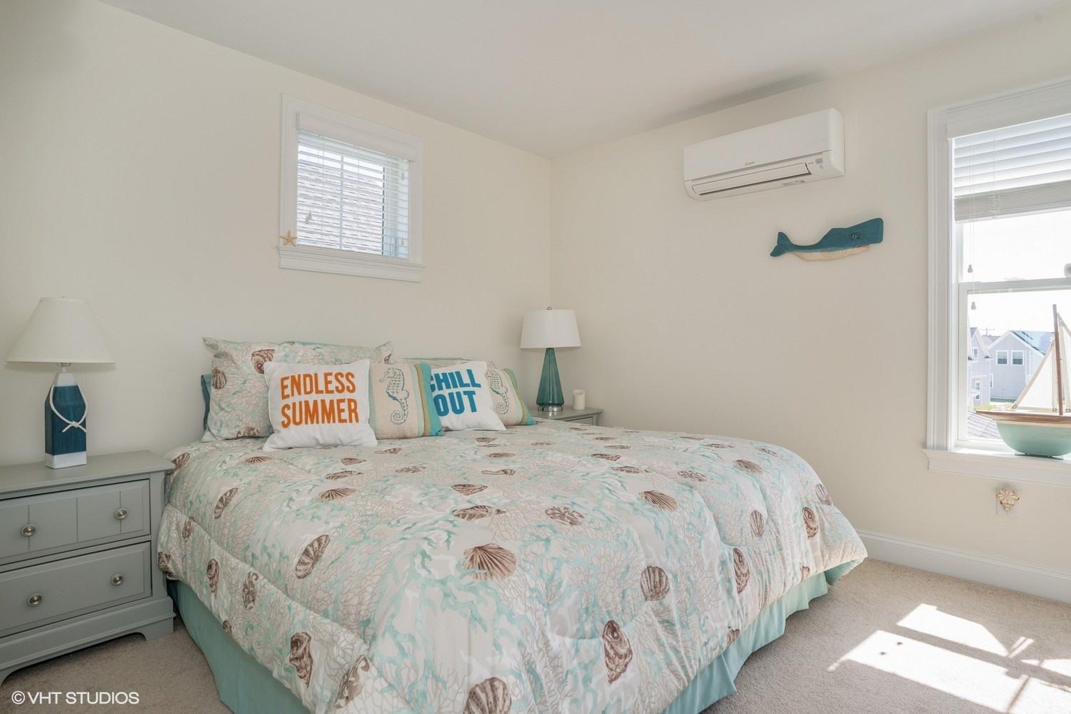 61 Old Wharf Road, Unit 62 Dennis Port, MA 02639 - Photo 16 of 25 a bedroom with a bed and a window