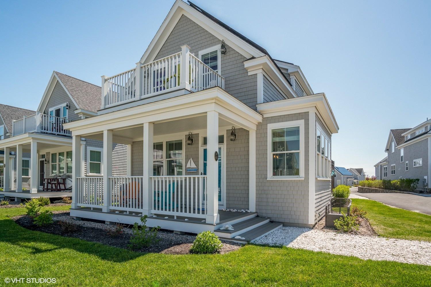 61 Old Wharf Road, Unit 62 Dennis Port, MA 02639 - Photo 2 of 25 front view of a house with a yard
