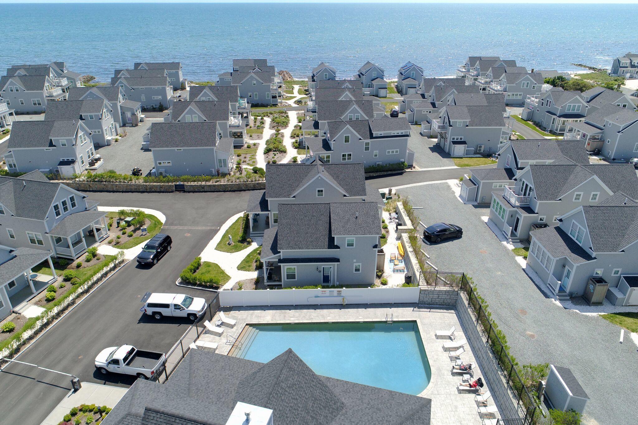 61 Old Wharf Road, Unit 62 Dennis Port, MA 02639 - Photo 25 of 25 an aerial view of residential houses with outdoor space