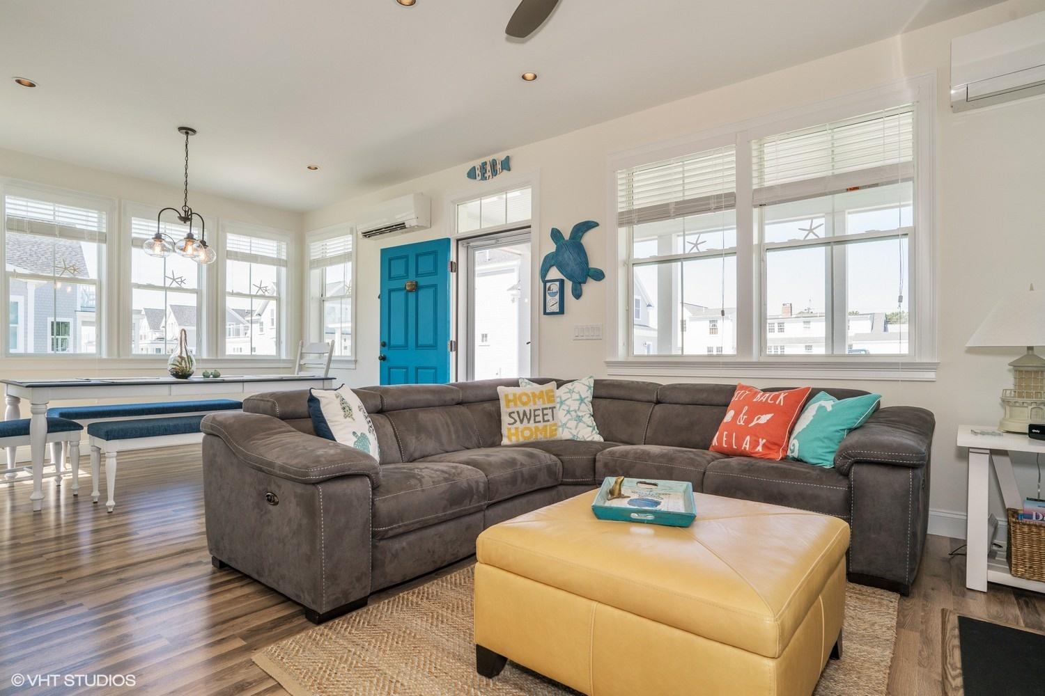 61 Old Wharf Road, Unit 62 Dennis Port, MA 02639 - Photo 7 of 25 a living room with furniture and a large window
