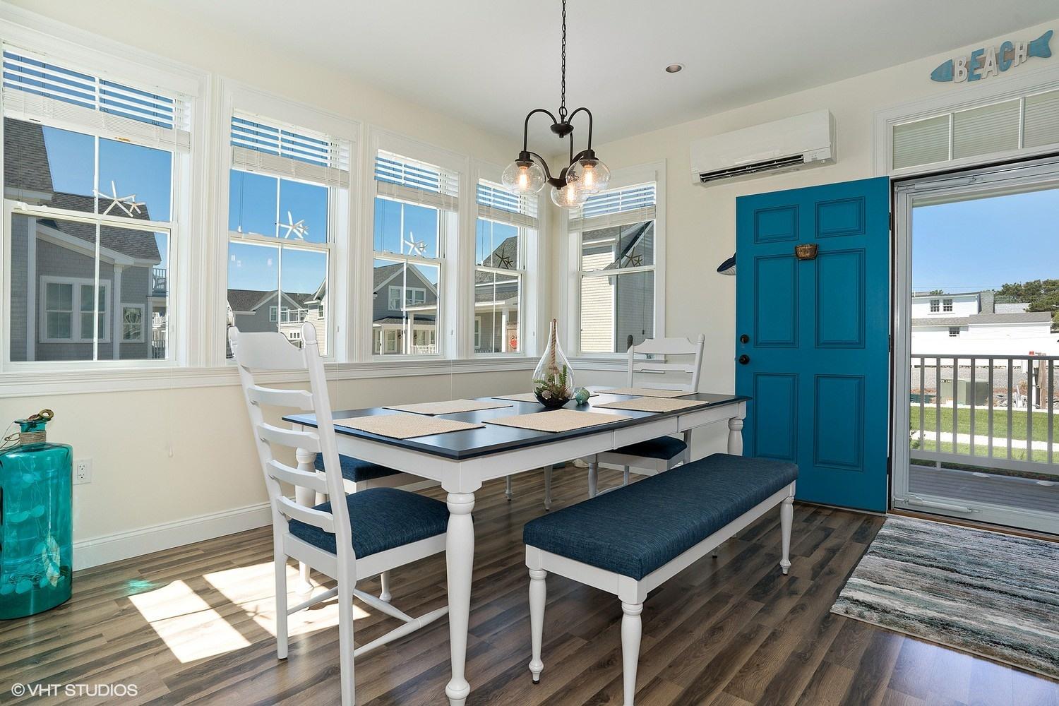 61 Old Wharf Road, Unit 62 Dennis Port, MA 02639 - Photo 9 of 25 a view of a dining room with furniture and window