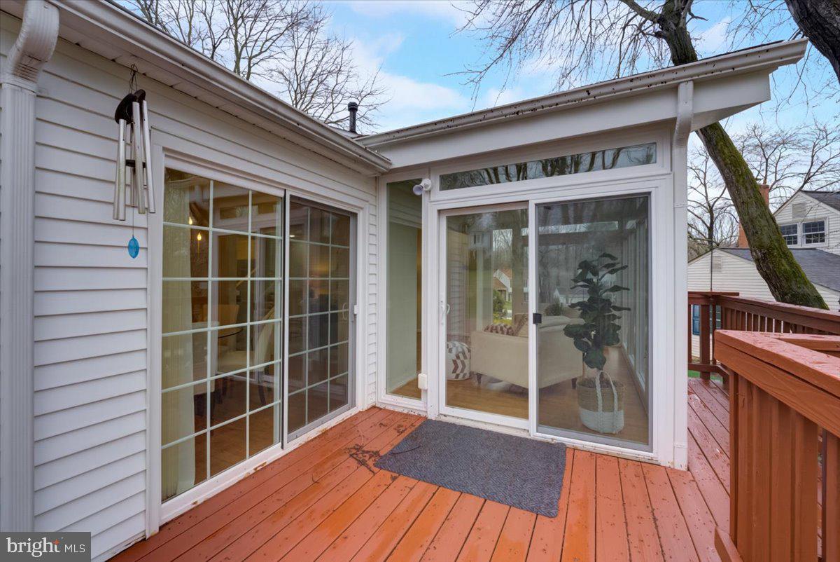 8024 West Point Drive Springfield, VA 22153 - Photo 51 of 55 Sunroom and DR opens onto deck