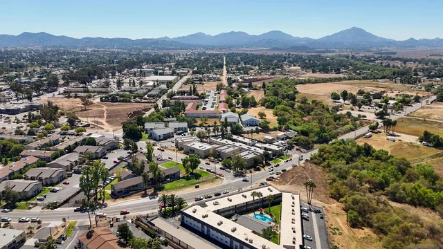 an aerial view of residential houses with outdoor space