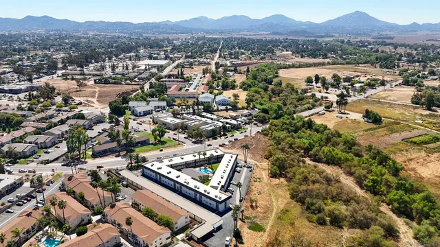 an aerial view of residential house and sandy dunes