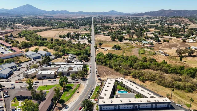 an aerial view of residential house and sandy dunes