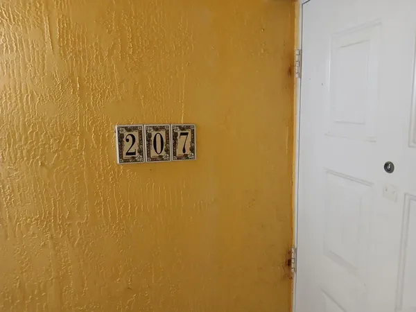 a view of an empty room and a window