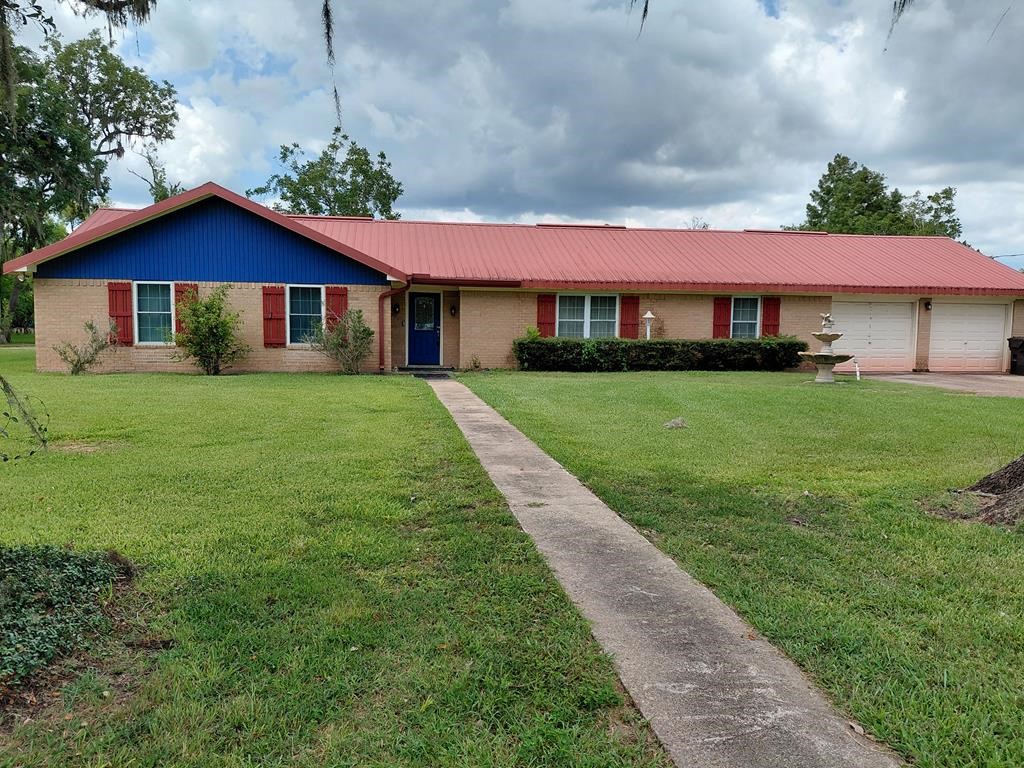 a front view of a house with yard