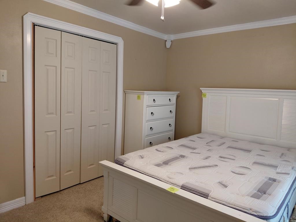 1231 County Road 201A Angleton, TX 77515 - Photo 15 of 26 a bedroom with a bed and a dresser