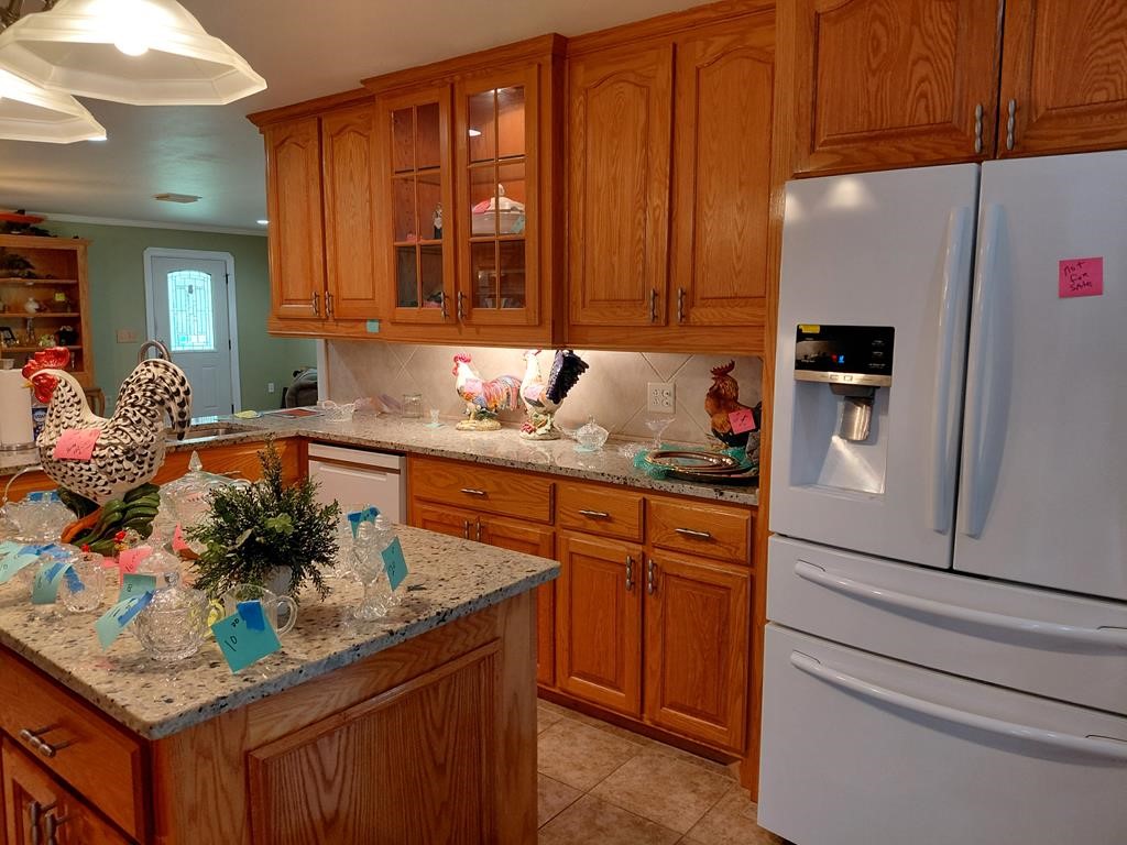 1231 County Road 201A Angleton, TX 77515 - Photo 18 of 26 a kitchen with stainless steel appliances granite countertop a refrigerator and a sink