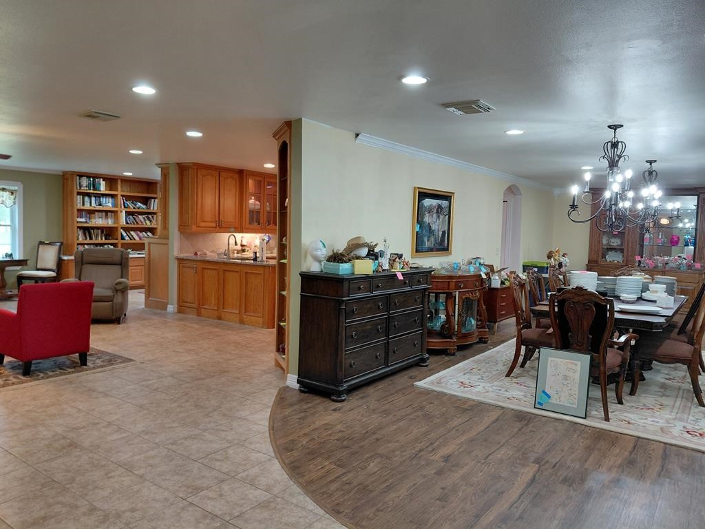 1231 County Road 201A Angleton, TX 77515 - Photo 7 of 26 a room with stainless steel appliances kitchen island granite countertop furniture and a kitchen view