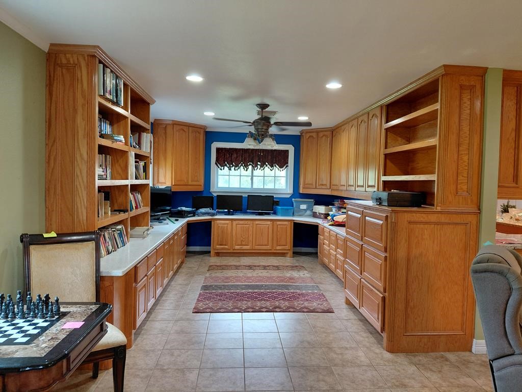 1231 County Road 201A Angleton, TX 77515 - Photo 10 of 26 a large kitchen with stainless steel appliances granite countertop a stove and a refrigerator