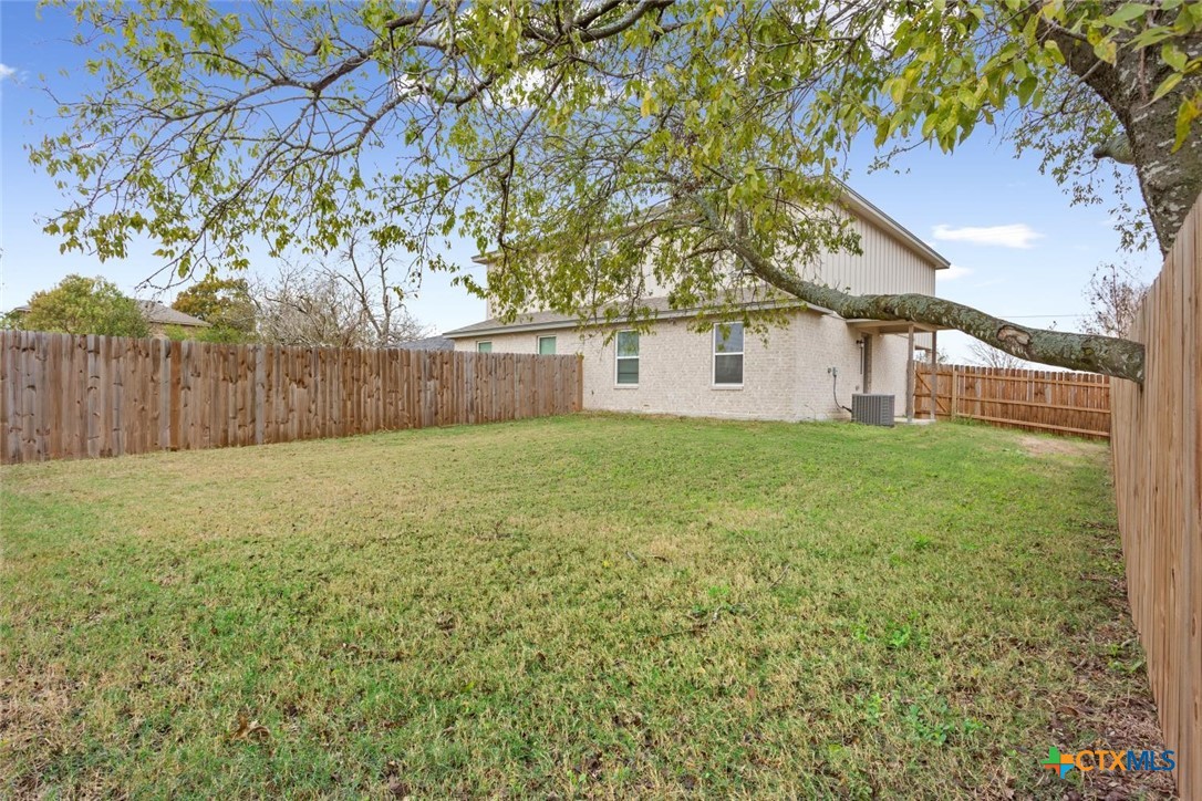 907 East Main Street, Unit A&B Troy, TX 76579 - Photo 28 of 28 a view of a house with a yard