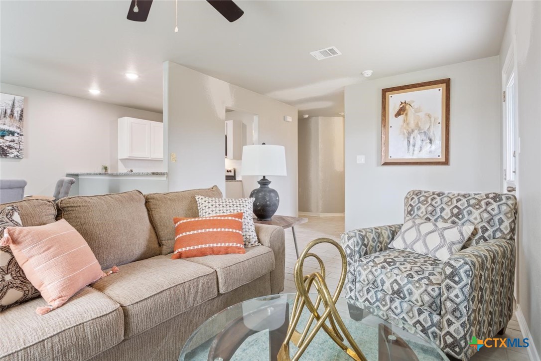 907 East Main Street, Unit A&B Troy, TX 76579 - Photo 4 of 28 a living room with furniture and painting on the wall