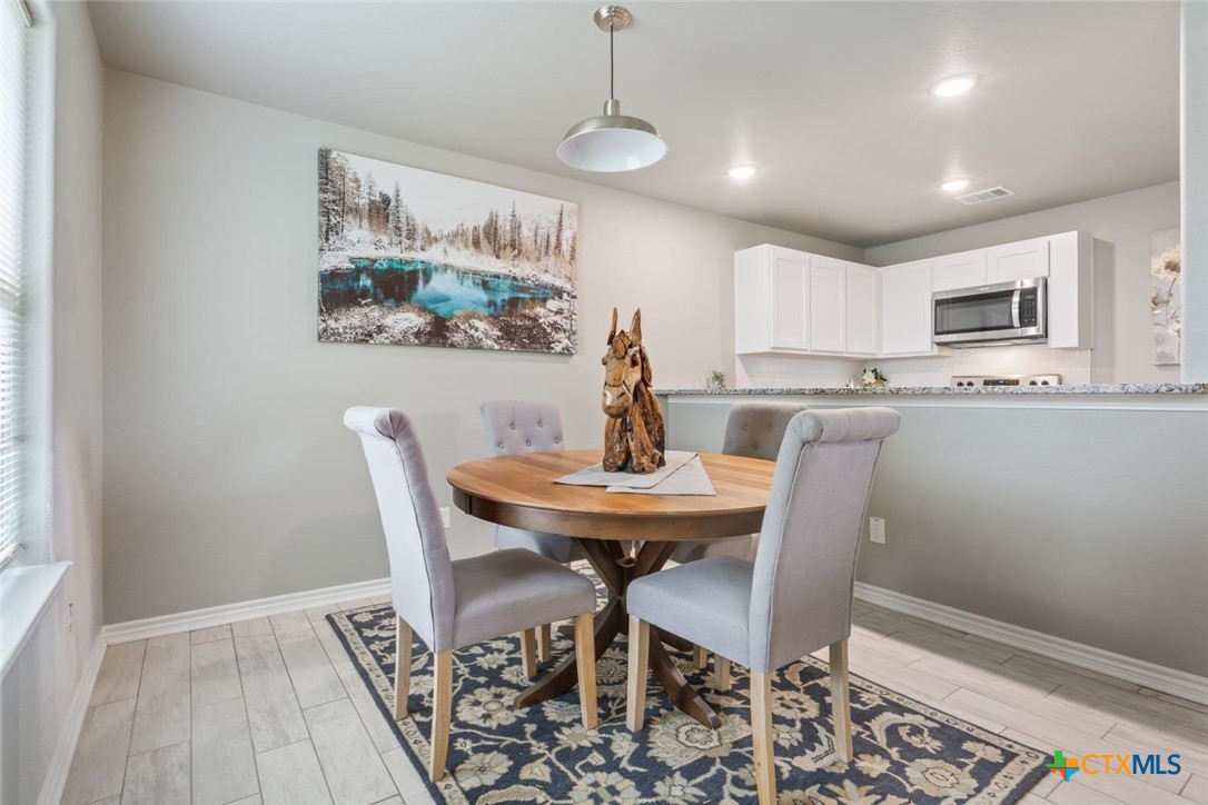 907 East Main Street, Unit A&B Troy, TX 76579 - Photo 8 of 28 a dining room with furniture and window