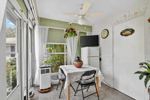 a view of a dining room with furniture window and chandelier