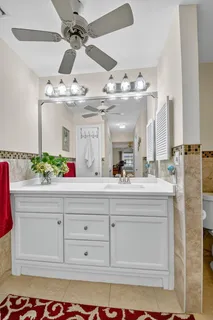 a living room with furniture flowerpot and window