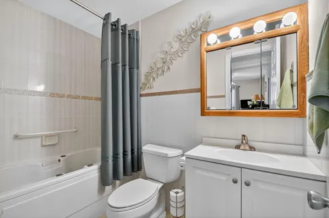 a bathroom with a toilet and a bathtub