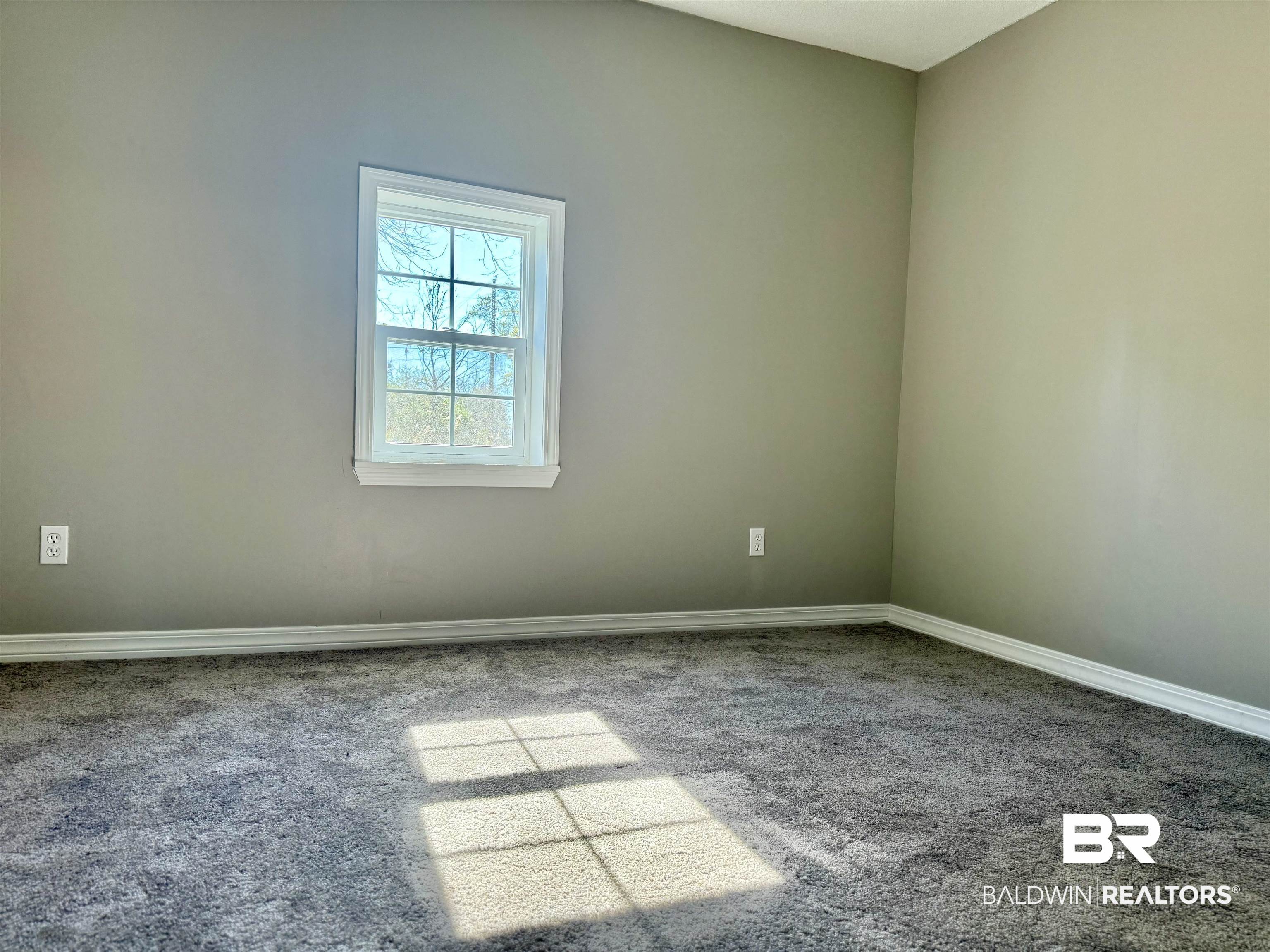205 Schad Street Brewton, AL 36426 - Photo 8 of 11 Carpeted empty room with baseboards
