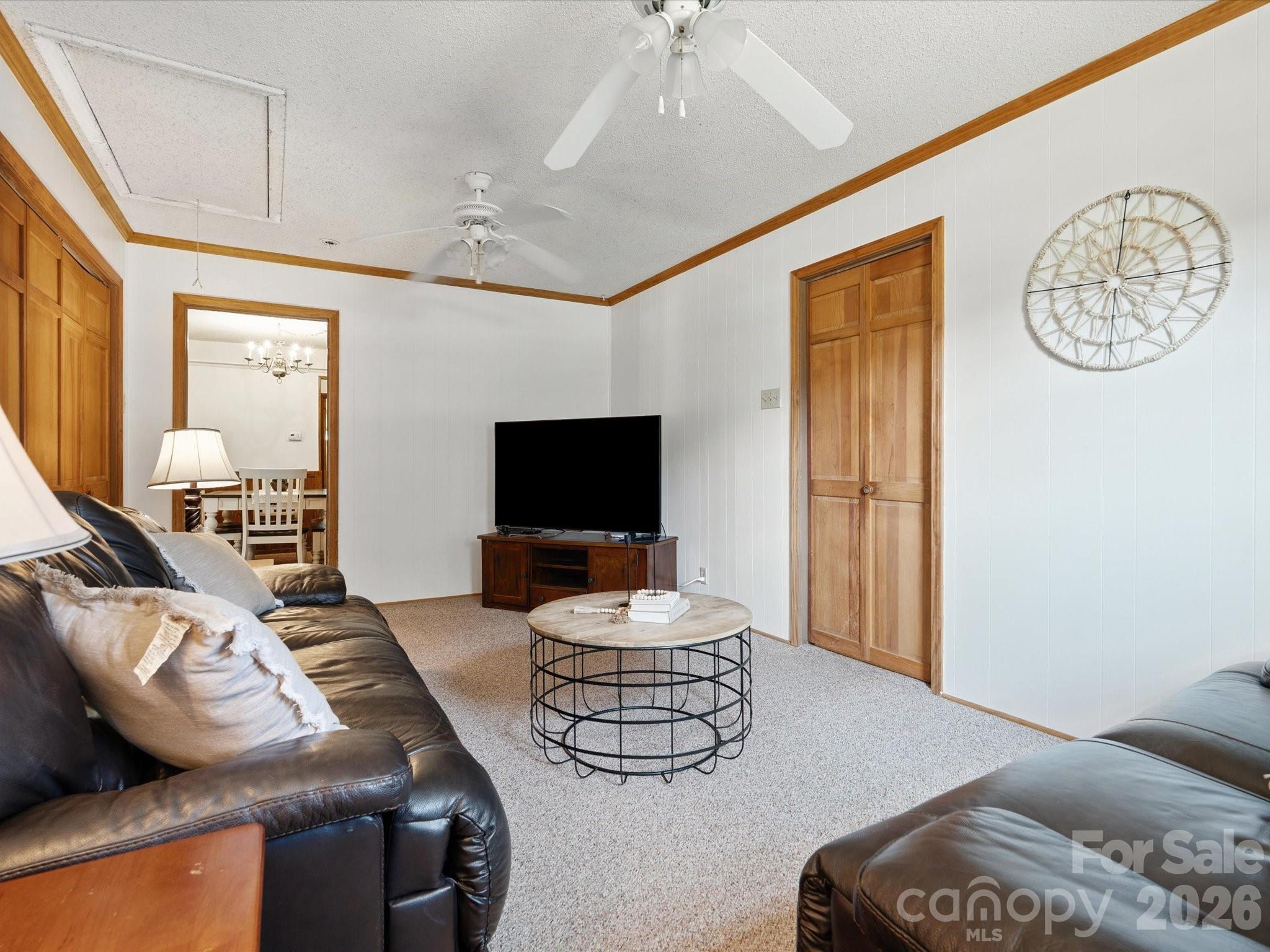 2212 J B Denton Road Lancaster, SC 29720 - Photo 12 of 38 a living room with furniture a flat screen tv and a window