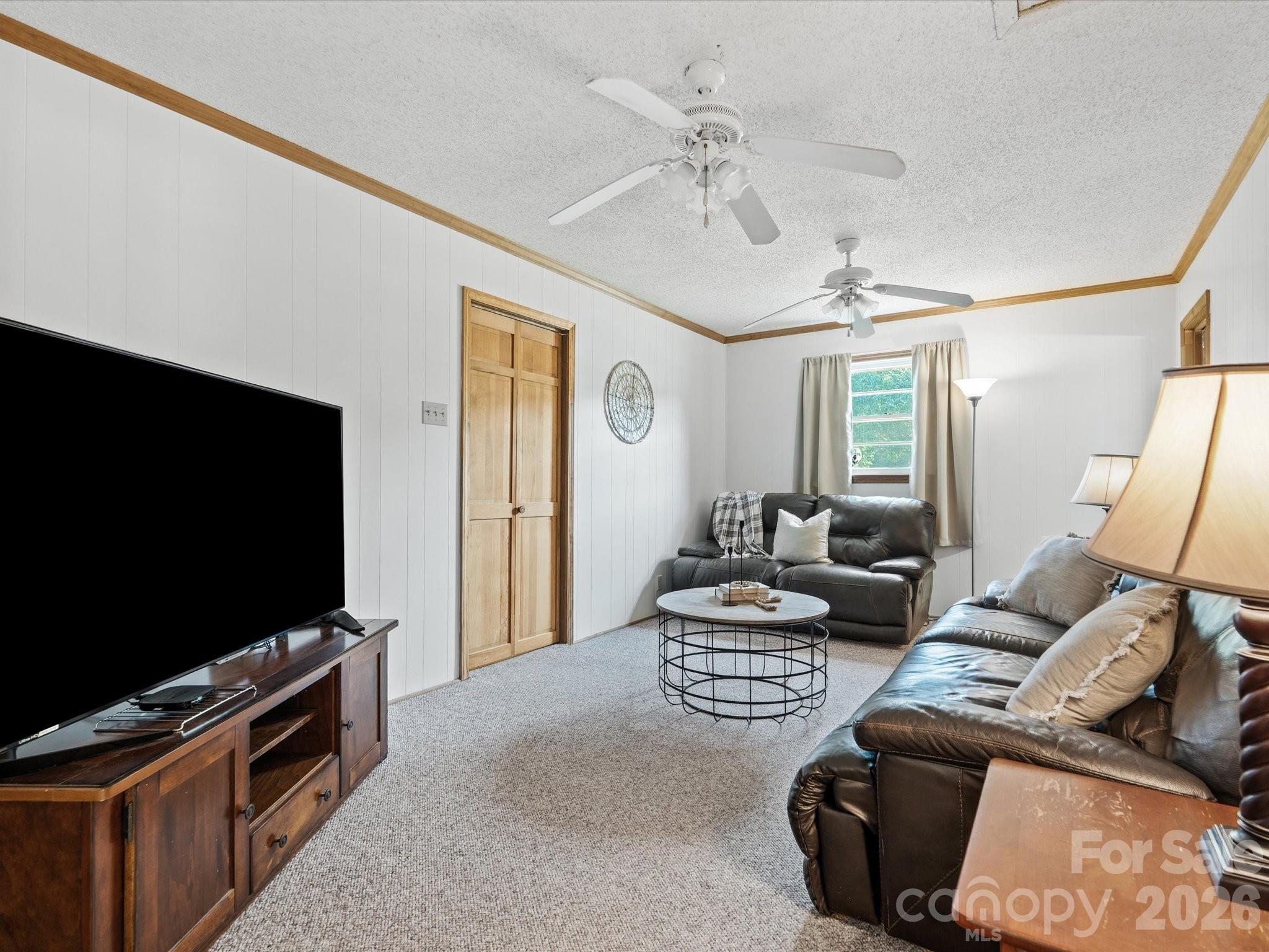 2212 J B Denton Road Lancaster, SC 29720 - Photo 14 of 38 a living room with furniture and a flat screen tv