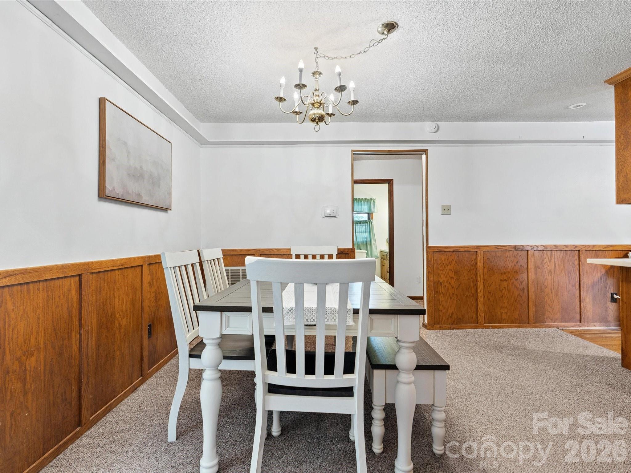 2212 J B Denton Road Lancaster, SC 29720 - Photo 15 of 38 a view of a dining room with furniture and chandelier