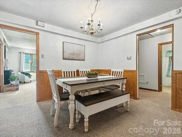 a bedroom with furniture and a chandelier