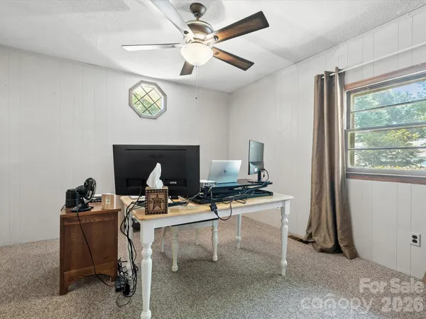a workspace with furniture and window