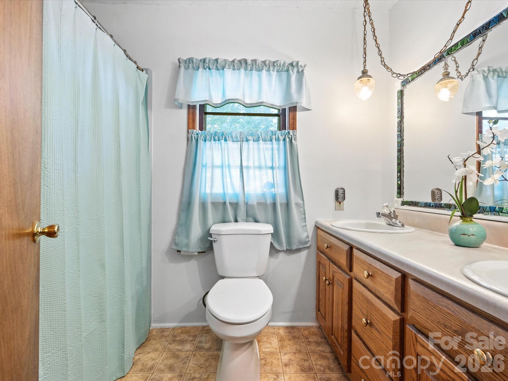 2212 J B Denton Road Lancaster, SC 29720 - Photo 26 of 38 a bathroom with a sink a toilet and shower