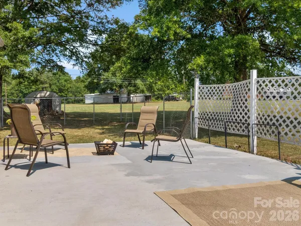 a park with bench and lake view