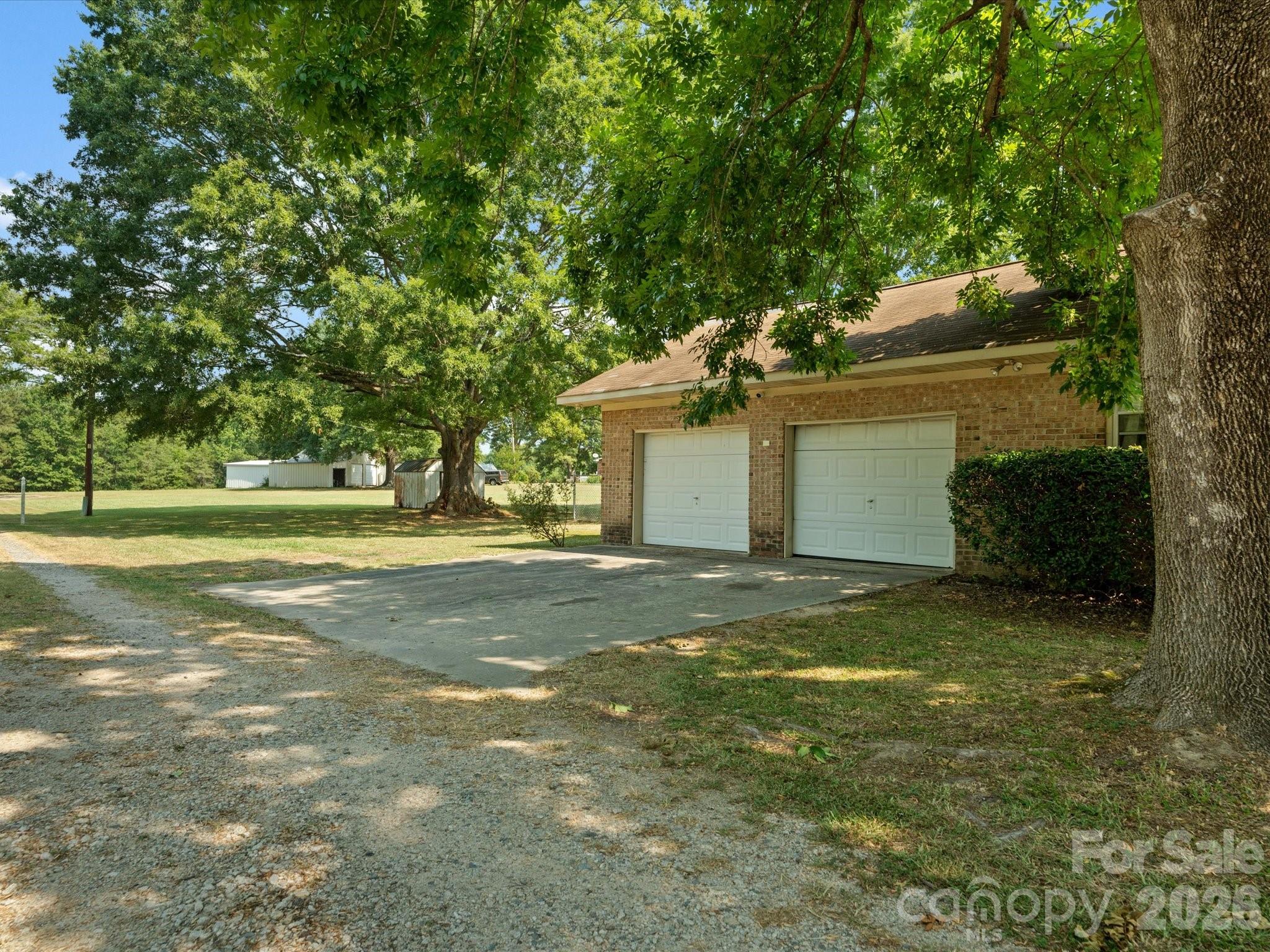 2212 J B Denton Road Lancaster, SC 29720 - Photo 34 of 38 a view of a house with yard and garage