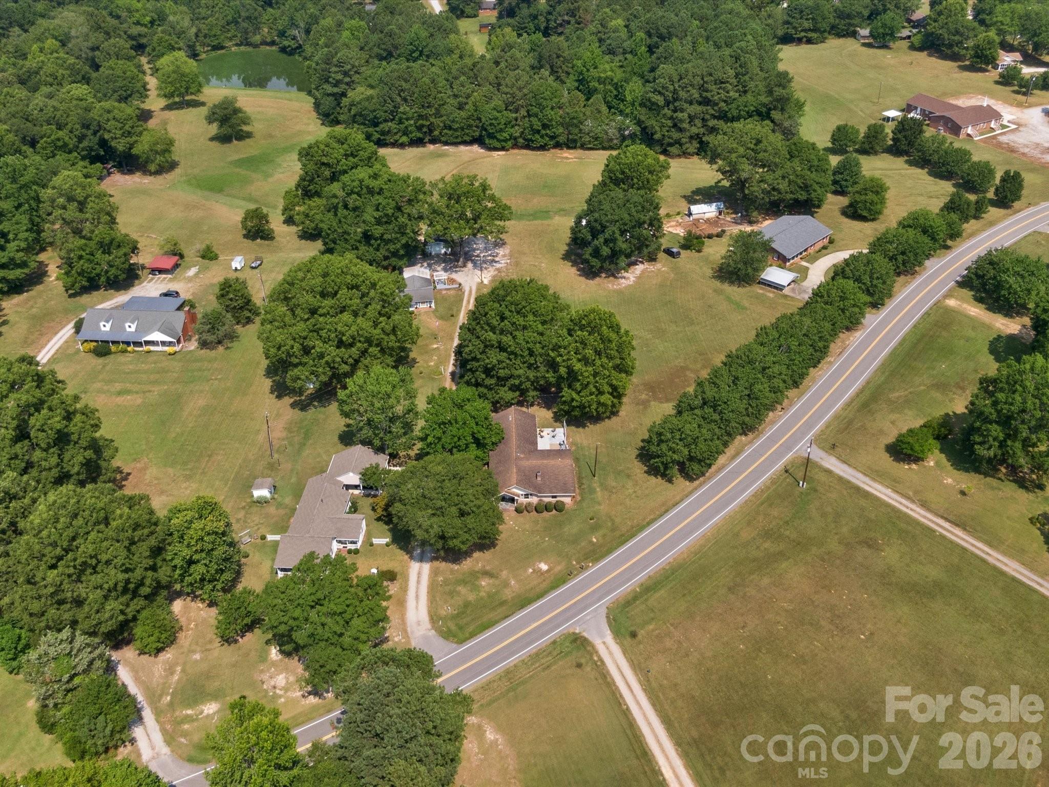 2212 J B Denton Road Lancaster, SC 29720 - Photo 36 of 38 an aerial view of residential houses with outdoor space and street view