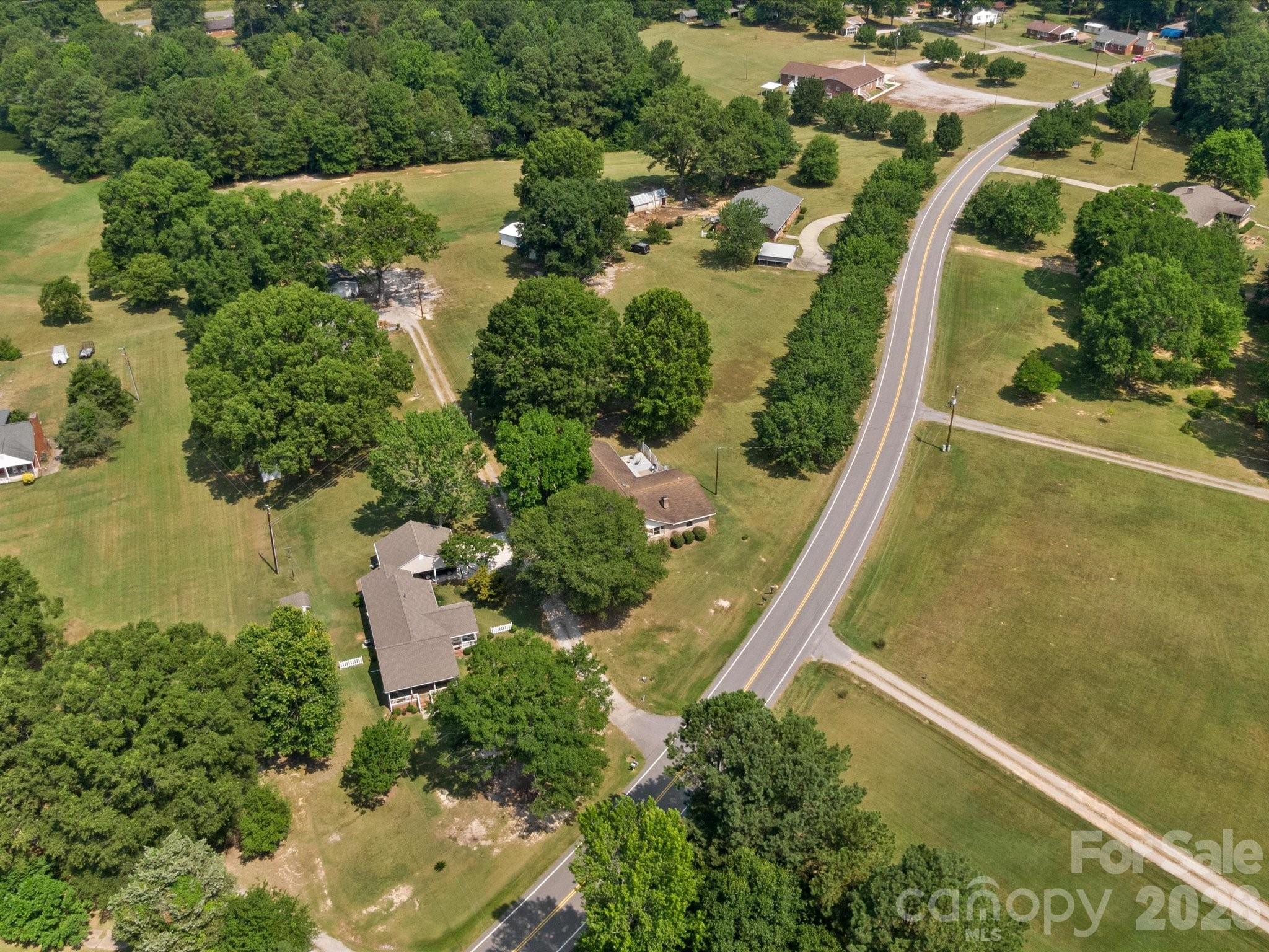 2212 J B Denton Road Lancaster, SC 29720 - Photo 37 of 38 an aerial view of a house with a yard and lake view