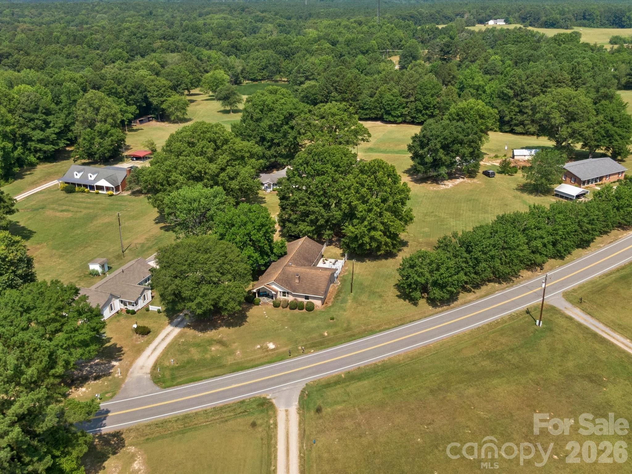 2212 J B Denton Road Lancaster, SC 29720 - Photo 38 of 38 an aerial view of residential houses with outdoor space and street view