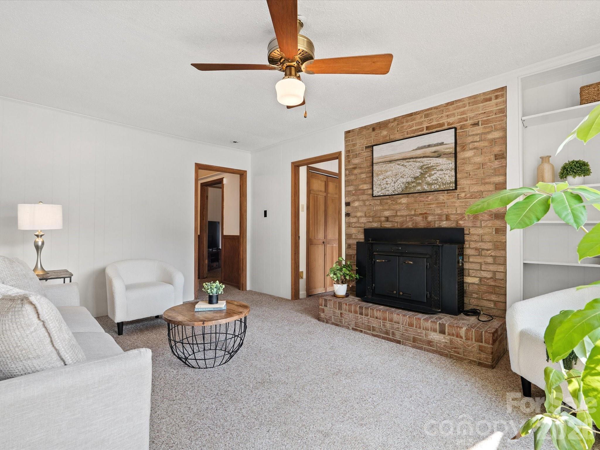 2212 J B Denton Road Lancaster, SC 29720 - Photo 4 of 38 a living room with furniture and a fireplace