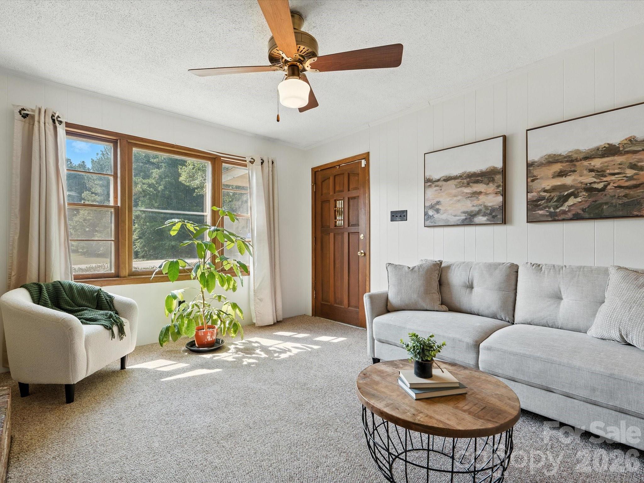 2212 J B Denton Road Lancaster, SC 29720 - Photo 6 of 38 a living room with furniture and a large window
