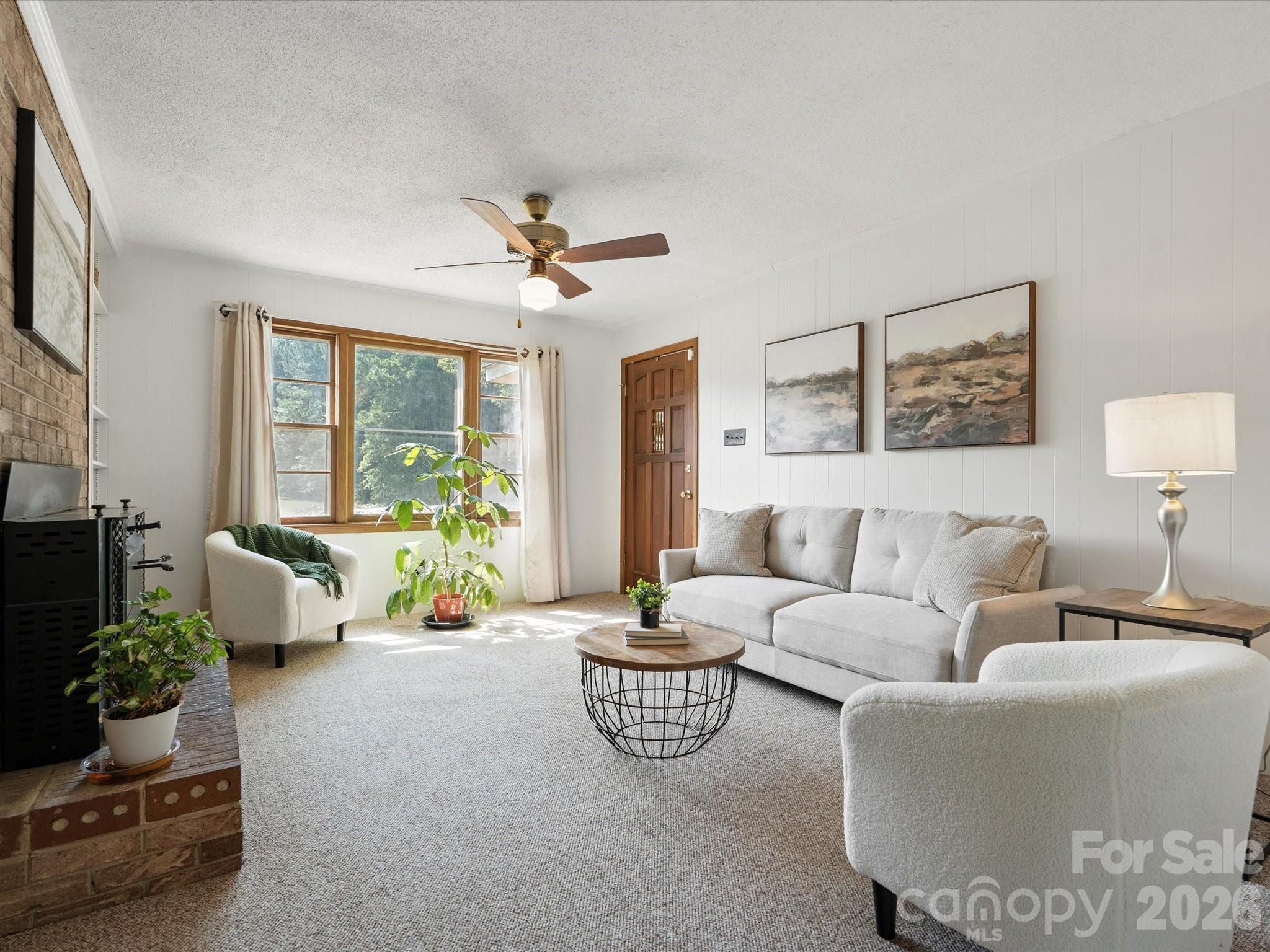 2212 J B Denton Road Lancaster, SC 29720 - Photo 7 of 38 a living room with furniture flowerpot and window