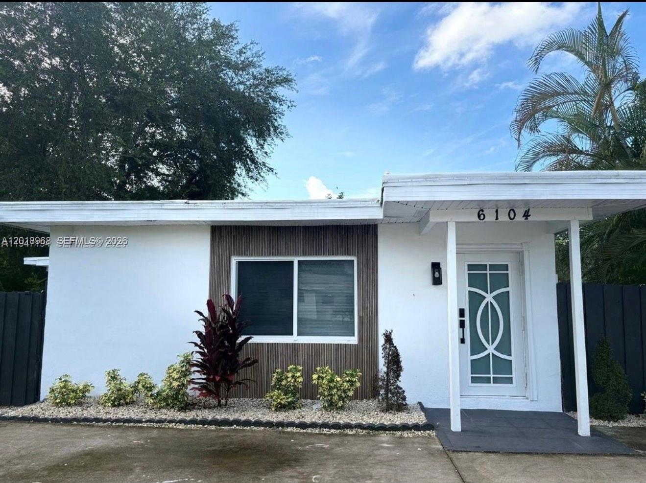 6104 Southwest 33rd Street Miramar, FL 33023 - Photo 1 of 18 a front view of a house