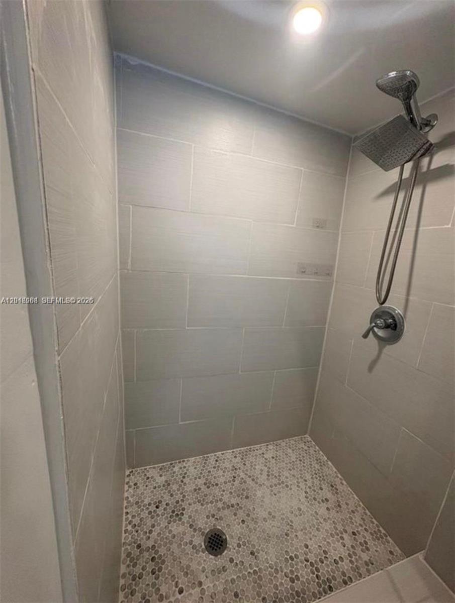 6104 Southwest 33rd Street Miramar, FL 33023 - Photo 14 of 18 a bathroom with a shower