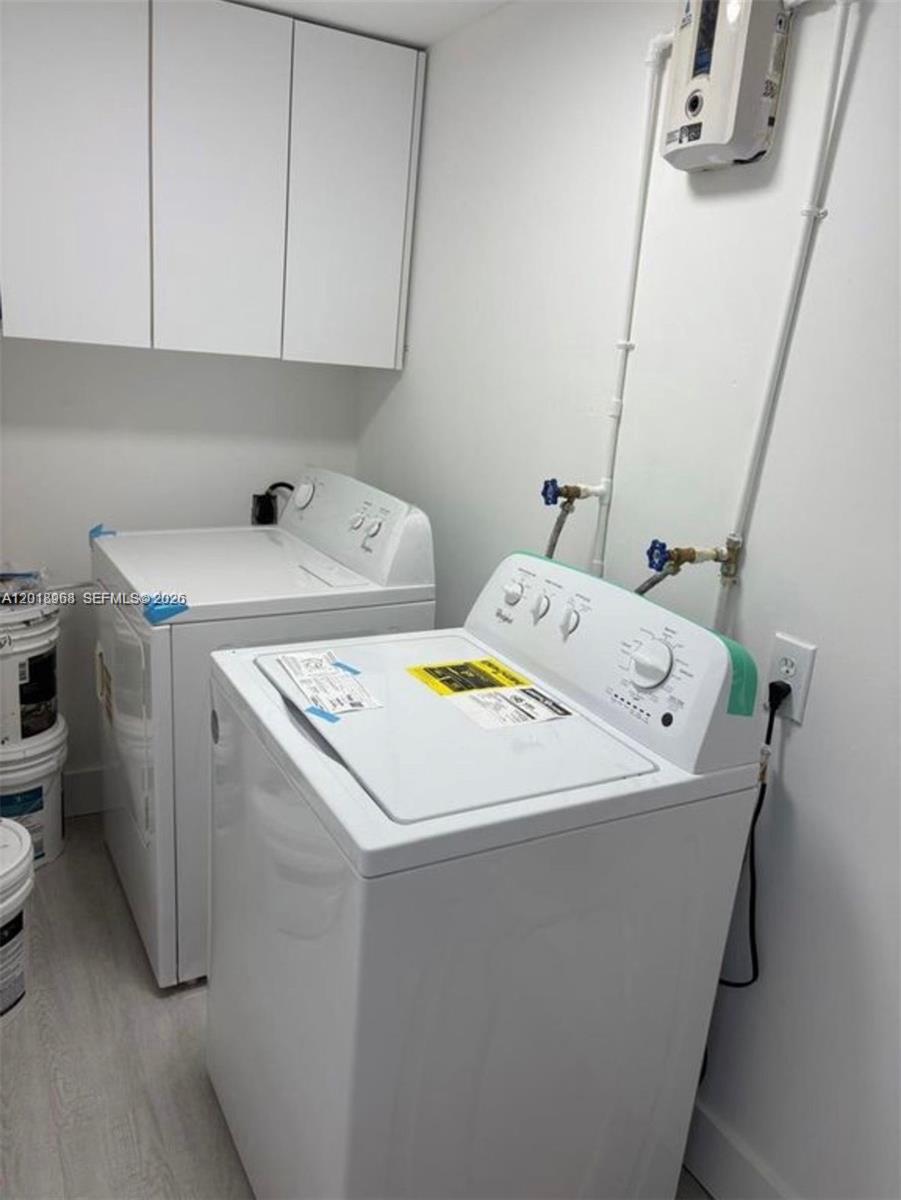 6104 Southwest 33rd Street Miramar, FL 33023 - Photo 18 of 18 a utility room with dryer and washer