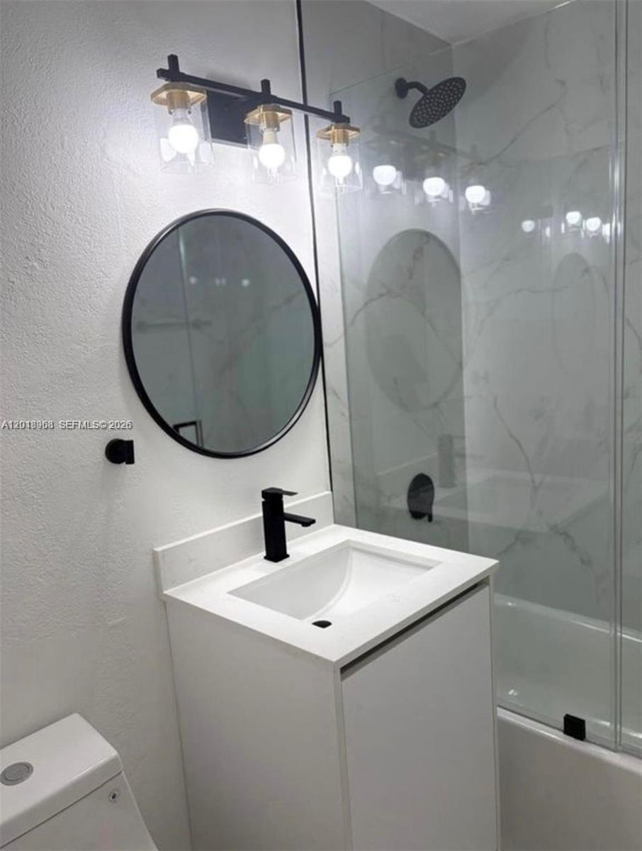 6104 Southwest 33rd Street Miramar, FL 33023 - Photo 7 of 18 a bathroom with a sink and a mirror