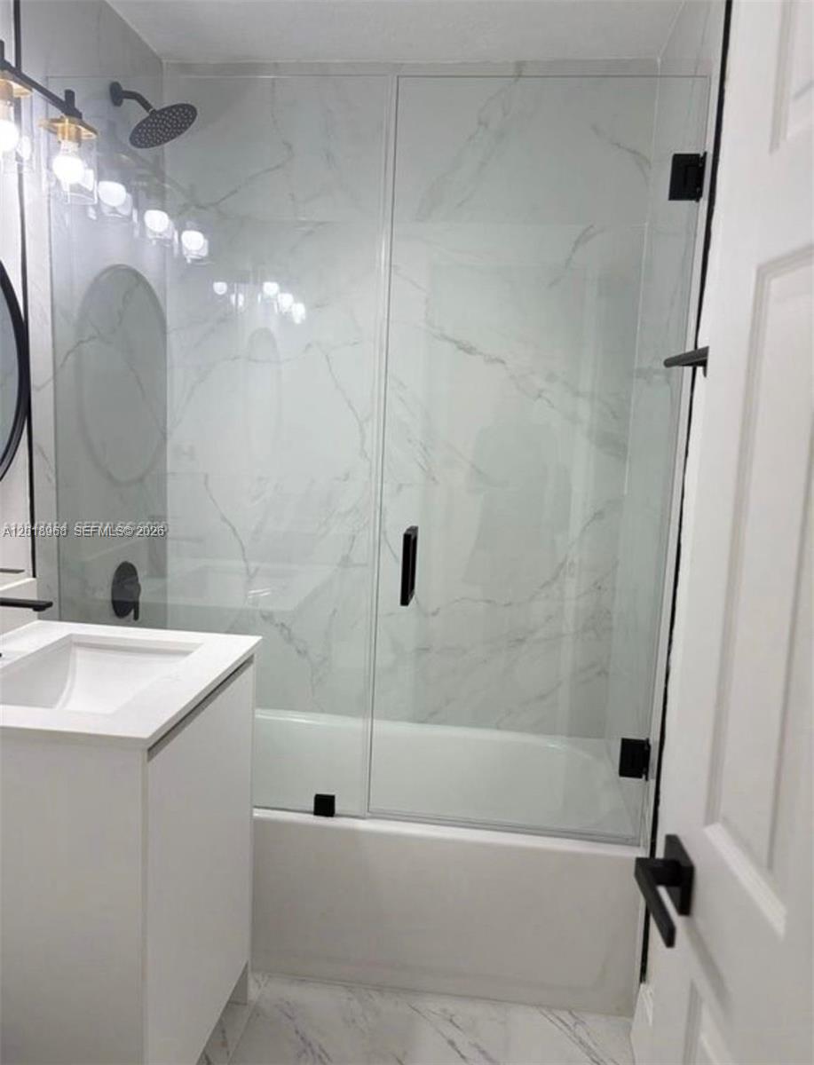6104 Southwest 33rd Street Miramar, FL 33023 - Photo 8 of 18 a bathroom with a sink a toilet and shower